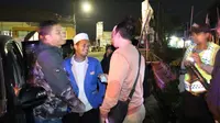 Saalah satu peserta people power asal Garut, terpaksa dihentikan polres Garut tadi malam (Liputan6.com/Jayadi Supriadin)