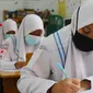 Pembelajaran tatap muka siswa di Pekanbaru dalam pandemi Covid-19. (Liputan6.com/M Syukur)