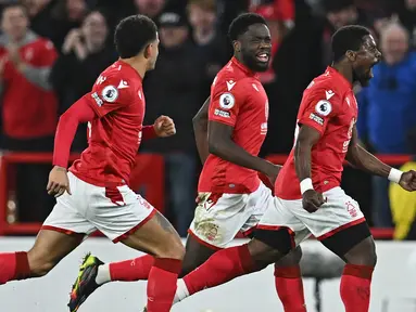 Sebagai tim promosi di Liga Inggris musim ini, Nottingham Forest melakukan belanja besar-besaran dengan banyak mendatangkan pemain baru dari berbagai negara, seperti para pemain asal Afrika. Tercatat Dari total 39 pemain dalam skuad Nottingham Forest musim 2022/2023 ini, Forest memiliki 7 pemain Afrika yang menjadi terbanyak kedua setelah pemain lokal Inggris sendiri yang berjumlah 13 pemain. Berikut ketujuh pemain asal Afrika tersebut. (AFP/Paul Ellis)