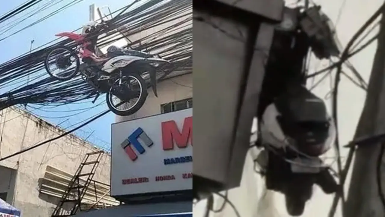 Sepeda Motor Nyangkut di Kabel Listrik