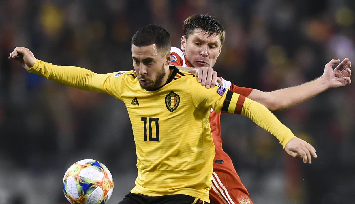 Aksi bintang timnas Belgia, Eden Hazard pada laga perdana Kualifikasi Piala Eropa 2020 Grup I yang berlangsung di Stadion Roi Baudouin, Brussels, Jumat (22/3). Belgia menang 3-1 atas Rusia. (AFP/John Thys)
