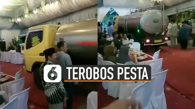 Sebuah truk tangki air nekat melintas di karpet merah pesta.