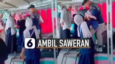 Video kocak istri ambil uang suami saat sedang nyawer biduan viral di media sosial. Wajah istrinya yang cantik membuat netizen ramai membicarakannya.