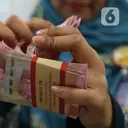 Kurs Rupiah Kembali Dekati 18.000 per Dolar AS