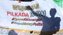 Mahasiswa yang tergabung dalam Tim Pengawal Pilkada Jakarta (TPPJ ) KAMMI menggelar aksi damai pada kegiatan Car Free Day di Jakarta, Minggu (9/4). Mereka menyerukan agar masyarakat menolak money politik dalam Pilkada DKI 2017. (Liputan6.com/Angga Yuniar)
