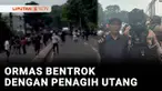 Dipicu masalah penarikan sepeda motor, sekelompok penagih utang bentrok dengan ormas di jalan raya Bogor-Depok, Jawa Barat. Kedua kelompok ini bentrok membekali diri dengan senjata tajam.