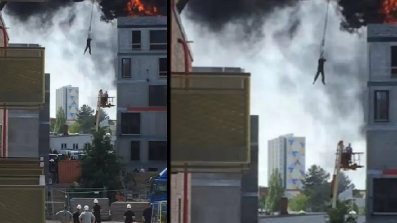 Korban terjebak kebakaran diselamatkan menggunakan crane. (Screen Grab)