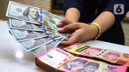 Adapun indeks dolar AS menguat 0,18% ke 105,80. (Liputan6.com/Angga Yuniar)