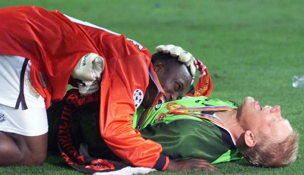 Peter Schmeichel bersama Dream Team asuhan Sir Alex Ferguson berhasil meraih trofi Liga Inggris, Piala FA, dan Liga Champions. (Foto: AFP/Eric Cabanis)