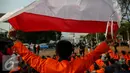 Mahasiswa Universitas Atma Jaya saat menggelar aksi damai di depan Istana Merdeka, Jakarta, Jumat (25/9/2015). Mereka meminta pemerintah menuntaskan pelanggaran HAM 16 Tahun lalu dalam tragedi Semanggi II. (Liputan6.com/Faizal Fanani)