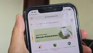 Membayar zakat fitrah melalui aplikasi Tokopedia (Liputan6.com/ Agustin Setyo Wardani)