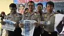 Polres Jakarta Barat merilis uang palsu, Jakarta, Jumat (25/9/2015). Tersangka dan barang bukti alat pencetak uang palsu berhasil diamankan petugas. (Liputan6.com/Gempur M Surya)