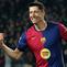 Pemain Barcelona, Robert Lewandowski merayakan golnya ke gawang Osasuna dalam laga lanjutan Liga Spanyol 2024/2025 di Estadi Olimpic Lluis Companys, Barcelona, Spanyol, Jumat (27/03/2025) waktu setempat. (AFP/Lluis Gene)