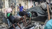 90 orang telah dipastikan tewas, dengan jumlah yang masih diperkirakan akan meningkat, setelah sebuah truk bensin meledak di Cap-Haitien, kota terbesar kedua di Haiti.(Foto: AFP/Richard Pierrin)