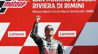 Pembalap Petronas Yamaha, Franco Morbidelli, melakukan selebrasi di atas podium usai menjuarai MotoGP San Marino di Sirkuit Misano, Minggu (13/9/2020). Morbidelli menjadi yang tercepat dengan catatan waktu 42 menit 02,272 detik. (AP/Antonio Calanni)