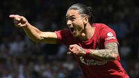 Liverpool rela merogoh 80 juta euro untuk mendatangkan Darwin Nunez dari Benfica pada bursa transfer musim panas ini. Namun, penampilannya di awal musim terlihat belum konsisten. Ia baru mencetak 3 gol dan 1 assist dari 8 penampilannya di Liga Inggris. Sementara itu, Nunez telah menorehkan 2 gol dalam 5 laga di Liga Champions. (AFP/Justin Tallis)