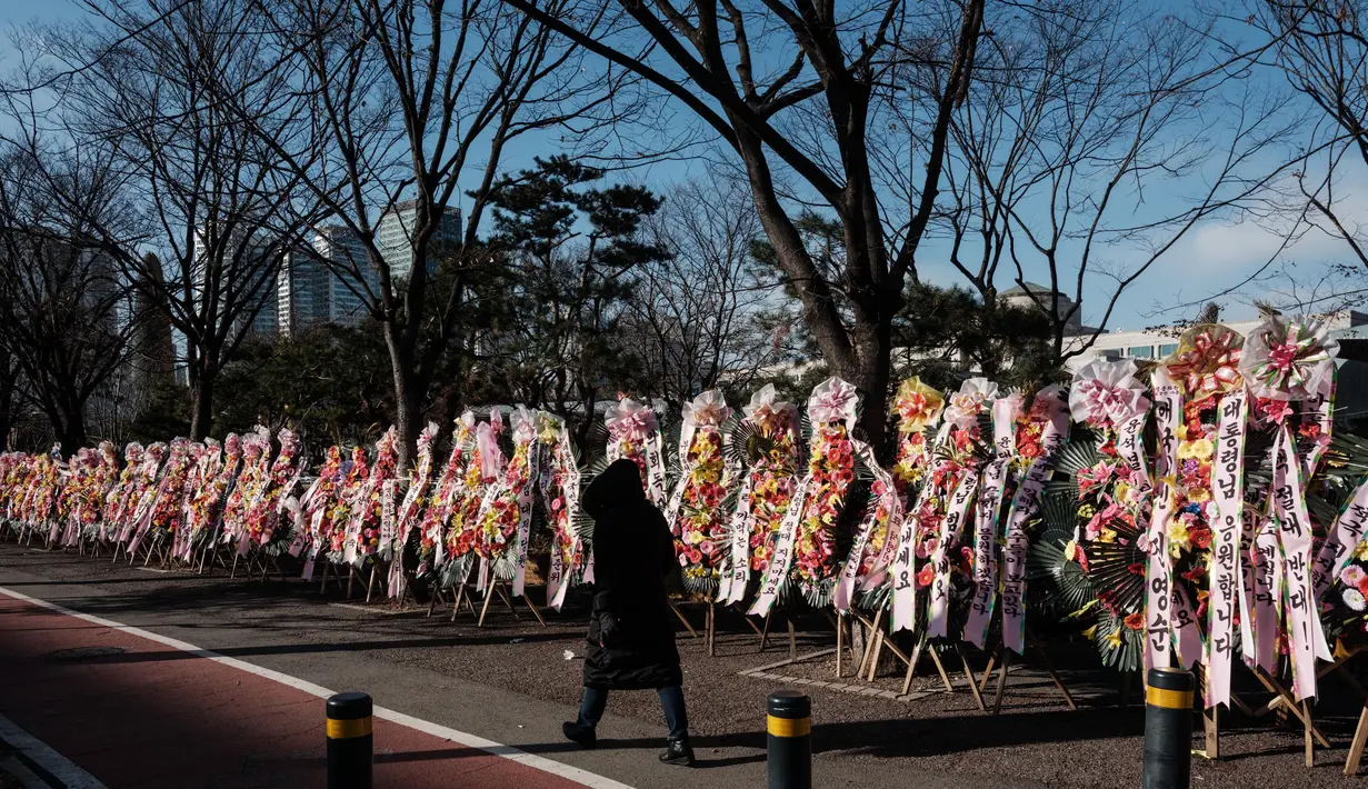 Diketahui, Presiden Yoon Suk Yeol dimakzulkan terkait upayanya memberlakukan darurat militer yang kemudian gagal dan membuat Korea Selatan bergejolak. (Yasuyoshi CHIBA/AFP)