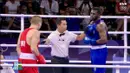 Wasit Indonesia, Muhammad Arisa Putra Pohan saat memimpin pertandingan semifinal tinju Olimpiade Paris 2024 antara petinju Ukraina, Oleksandr Khyzhniak (kiri) melawan petinju Brasil, Wanderley De Souza di North Paris Arena, Villepinte, Prancis, Jumat (02/08/2024). (Dok. NOC Indonesia)