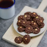 Ilustrasi kue semprit coklat./Copyright shutterstock.com/id/g/arissetya