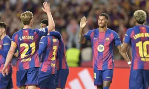 Marcus Rashford usai mencetak gol bersama Barcelona saat melawan Olympiacos di ajang Liga Champions 2025/2026. (MANAURE QUINTERO / AFP)