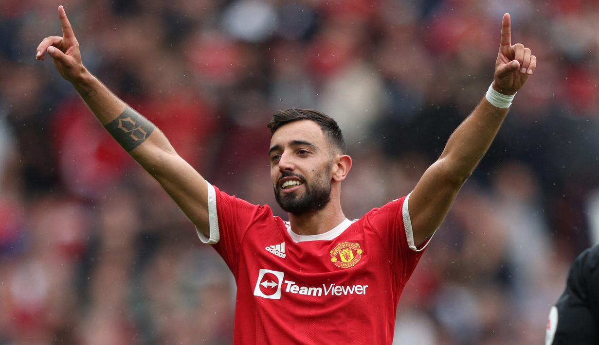 Manchester United tampil menggila di pekan pertama Liga Inggris 2021/2022 usai menghancurkan Leeds United 5-1 di Old Trafford Stadium, Sabtu (14/8/2021) malam WIB. Bruno Fernandes dan Paul Pogba menjadi bintang dengan membuat 3 gol dan 4 assist. (Foto: AFP/Adrian Dennis)
