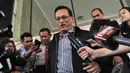 Didik memilih bungkam dan terus berjalan sambil menebar senyum, Jakarta, Kamis (9/10/2014) (Liputan6.com/Miftahul Hayat)
