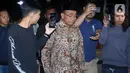 Penasihat Khusus Presiden Bidang Haji, Muhadjir Effendy, saat memasuki area Gedung Merah Putih Komisi Pemberantasan Korupsi (KPK), Jakarta, Senin (18/5/2026). (Liputan6.com/Helmi Fithriansyah)