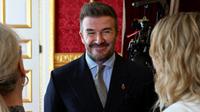 Mantan pemain sepak bola Inggris, David Beckham, tersenyum selama upacara Penghargaan King's Foundation, pada peringatan 35 tahun The King's Foundation, di Istana St James, London, pada 12 Juni 2025. (Chris J RATCLIFFE/POOL/AFP)