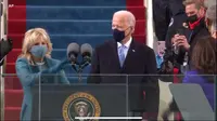 Joe Biden dan istri, Jill Biden bersiap masuk ke area pelantikan dan pengambilan sumpah jabatan di Gedung Capitol Hill, AS. (Live Streaming VOA)