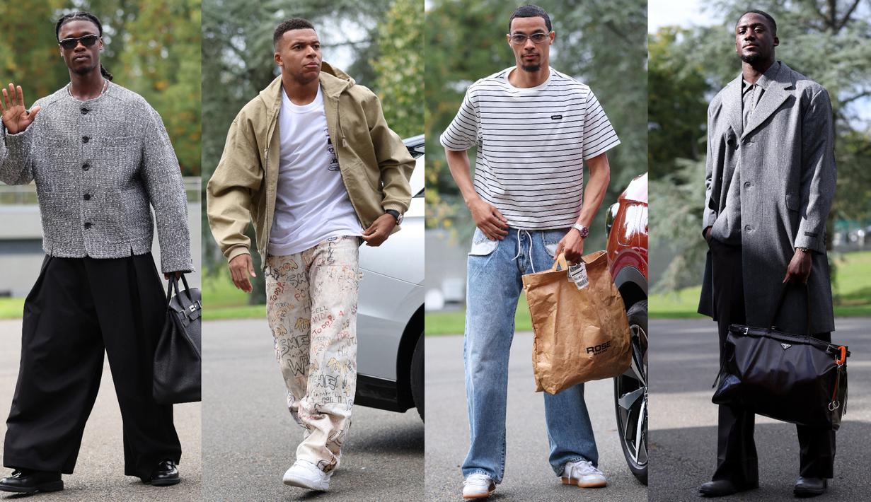 Kedatangan pemain Timnas Prancis sering menyita perhatian karena momen tersebut bak fashion show. Para pemain skuad Les Bleus terlihat mengenakan busana modis menjelang laga Grup D Kualifikasi Piala Dunia 2026 zona Eropa melawan Azerbaijan dan Islandia, Senin (06/10/2025). (AFP/Franck Fife)