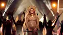 Hamil bukan penghalang bagi Beyonce Knowles untuk berkarya. Hadir di Grammy Awards 2017, tampilan Beyonce berhasil memukau para penonton yang hadir. Beberapa judul lagu dinyanyikan secara non-stop. (AFP/Bintang.com)