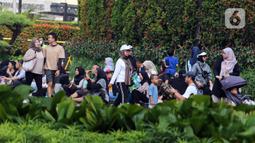 Sejak pagi, sejumlah warga tampak berolahraga di kawasan Sudirman-MH Thamrin. Ada yang berjalan santai, berlari, maupun bersepeda. (Liputan6.com/Herman Zakharia)