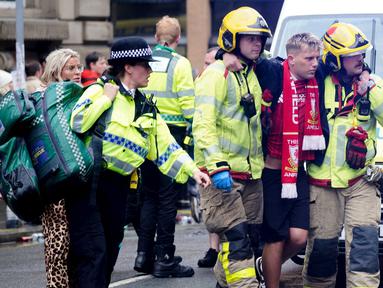 Momen euforia ribuan suporter Liverpool dalam parade kemenangan  Premier League berubah menjadi kepanikan setelah sebuah mobil menerobos kerumunan di pusat kota pada Senin (26/5/2025). (Owen Humphreys/PA via AP)