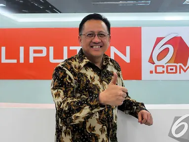 Ketua DPD Republik Indonesia Irman Gusman saat berkunjung ke Kantor Liputan6.com di SCTV Tower, Jakarta, Rabu (17/12/2014). (Liputan6.com/Johan Tallo) 