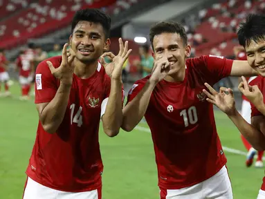 Final Piala AFF 2020 kali ini akan mempertemukan Timnas Indonesia dan Thailand di Singapore National Stadium dengan sistem dua leg. Partai ini semakin seru mengingat kedua tim memiliki pemain yang sedang bermain di klub Eropa. Berikut daftar pemainnya. (AP/Suhaimi Abdullah)