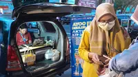 Aksi jemput bola rekam Identitas Kependudukan  Digital di Pasar Takjil Ramadhan Banyuwangi (Hermawan Arifianto/Liputan6.com)