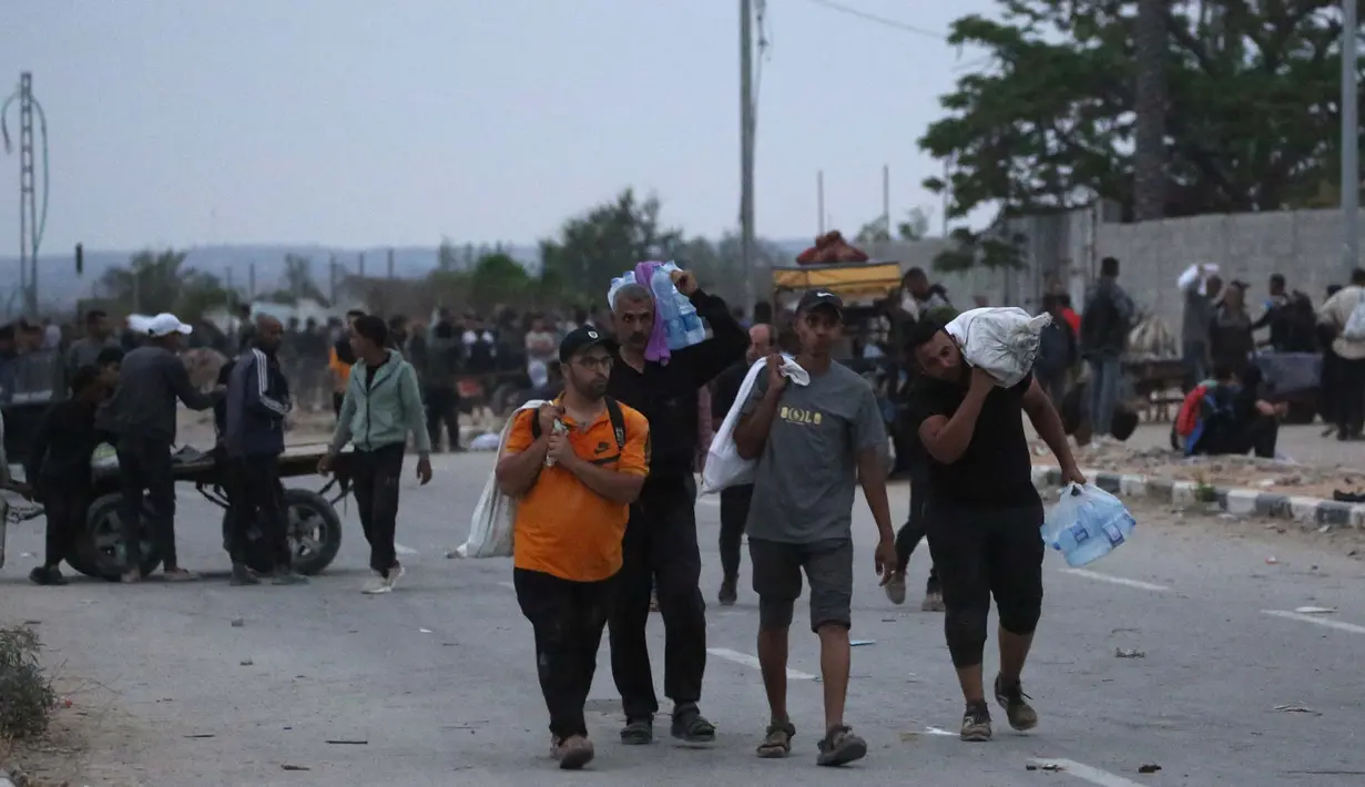Sebelumnya, pada Sabtu (7/6/2025), pemerintah di Jalur Gaza menyatakan kesiapan penuh untuk mengamankan konvoi bantuan kemanusiaan. (Eyad BABA/AFP)