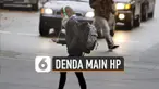 Pejalan kaki yang gunakan telepon seluler saat menyeberang jalan akan didenda Rp141 ribu.