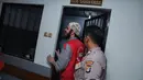 Rio Reifan kembali ke ruang tahanan usai persidangan. Ia harus menunggu tahanan lain sidang usai, setelah itu baru bisa kembali ke rutan. (Galih W. Satria/Bintang.com)