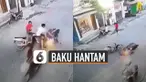 Terekam kamera cctv dua pengendara motor adu banteng dan akhirnya baku hantam di jalan.