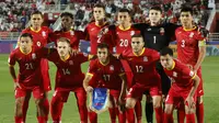 Skuad Timnas Kirgistan saat hadapi Oman di Piala Asia 2023 Qatar hari Kamis (25/01/2024). (KARIM JAAFAR / AFP)