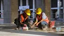Pekerja menyelesaikan proses renovasi Masjid Istiqlal Jakarta, Selasa (18/6/2019). Pemerintah merenovasi dan memperbaiki struktur bangunan Masjid Istiqlal yang merupakan salahsatu cagar budaya dengan anggaran sebesar Rp465 miliar. (Liputan6.com/Helmi Fithriansyah)
