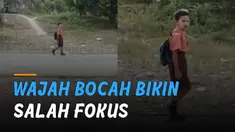 Seorang bocah laki-laki berangkat sekolah membuat salah fokus.