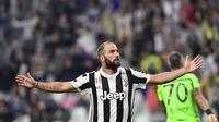 Gonzalo Higuain mencetak gol pertamanya di musim ini dalam kemenangan Juventus 3-0 atas Chievo, Sabtu (9/9/2017). (AFP / MIGUEL MEDINA)
