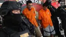 Tersangka pencurian dan pembunuhan sadis terhadap Jeanne Setyadi (78) tertunduk di Polda Metro Jaya, Jakarta, Kamis (26/7). Jeanne Setyadi atau nenek Jeanne ditemukan tewas pada akhir Mei lalu. (Liputan6.com/Immanuel Antonius)