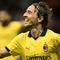 Pemain AC Milan, Luka Modric, merayakan gol yang dicetaknya ke gawang Bologna pada pekan 3 Liga Italia Serie A di Stadion San Siro, Senin (15/9/2025) dini hari WIB. (Stefano RELLANDINI / AFP)