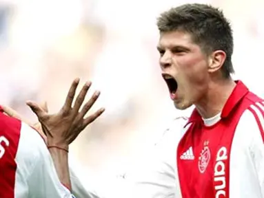 Dutch Ajax players Klaas Jan Huntelaar (R) and Edgar Davids cheer after the 3-0 for Ajax on April 20, 2008 during the last match in the Dutch Premier League against Heracles. AFP PHOTO / ANP PHOTO OLAF KRAAK