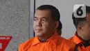 Wakil Menteri Imigrasi dan Pemasyarakatan (Wamen Imipas), Silmy Karim, berjalan menuju mobil tahanan usai menjalani pemeriksaan intensif di Gedung Merah Putih Komisi Pemberantasan Korupsi (KPK), Jakarta, Kamis (4/6/2026). (Liputan6.com/Helmi Fithriansyah)