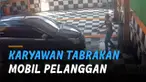 Diduga salah injak gas, mobil menghantam pilar baja dan nyaris menjepit petugas cuci mobil.