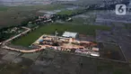 Foto udara sumur eksplorasi East Pondok Aren (EPN)-001 di WK PEP Tambun Field, Desa Sukawijaya, Tambelang, Kabupaten Bekasi, Jawa Barat, Kamis (28/12/2023). (merdeka.com/Imam Buhori)